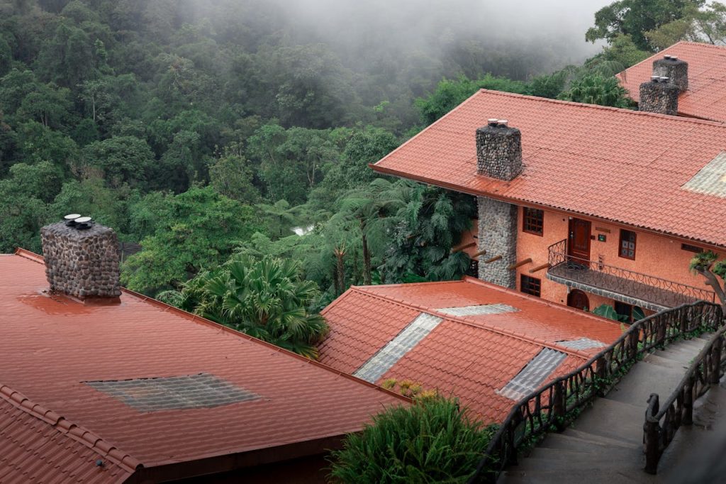A house with red roofs and red roofs on the side